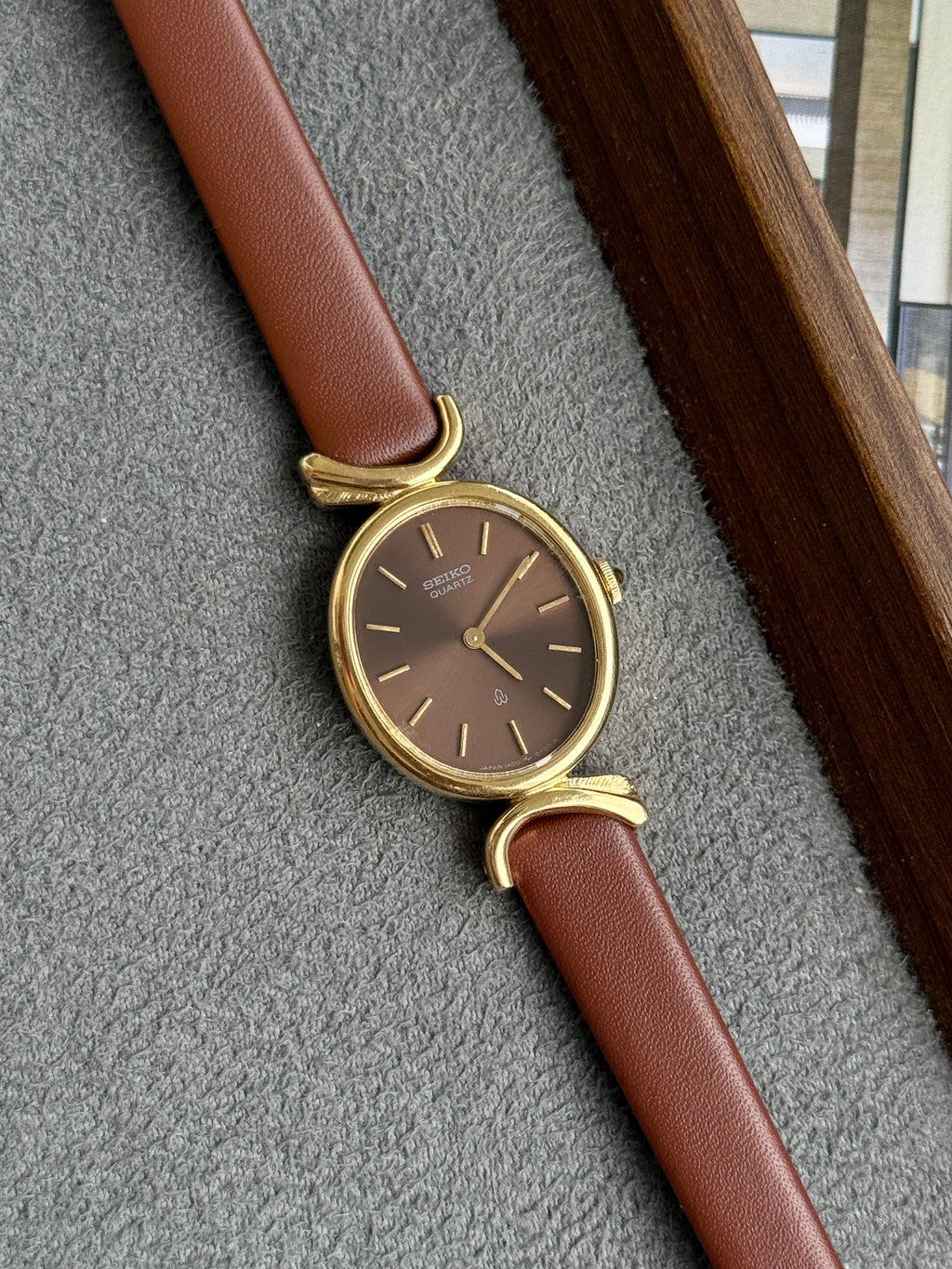 Rare Vintage 1980 Seiko Gold-Plated Oval Sunburst Brown Dial with Curved Lugs
